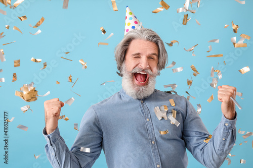Mature man celebrating birt...
