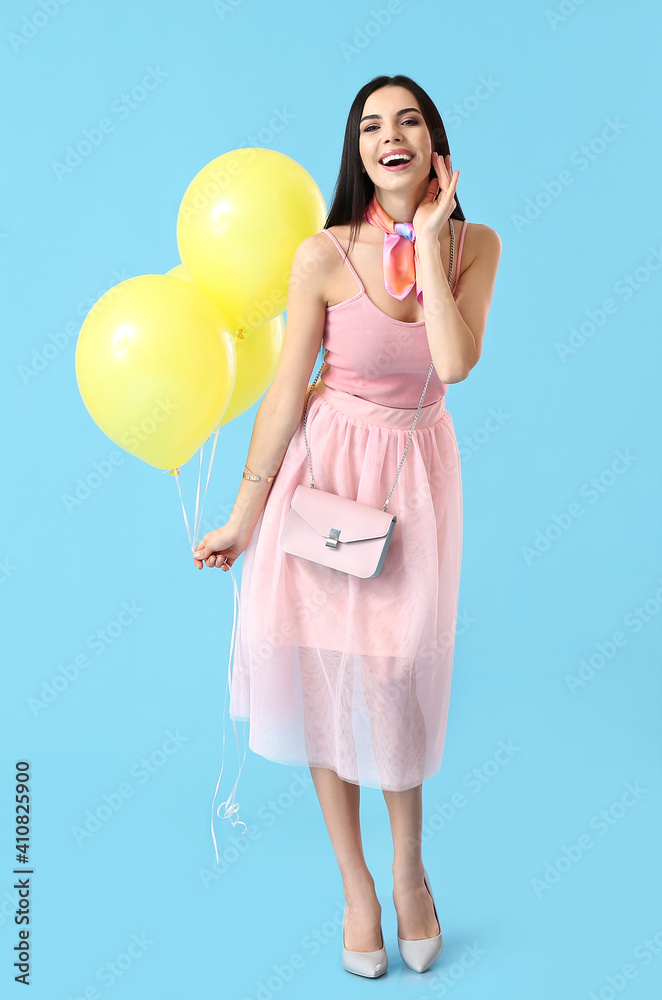 Beautiful young woman with balloons on color background Beautiful young woman with balloons on color background