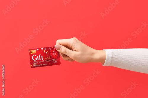 Female hand with gift card ...