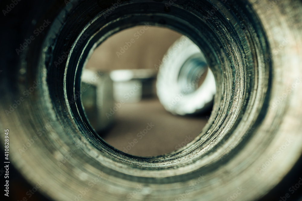 Macro shot of metal nuts on textured surface