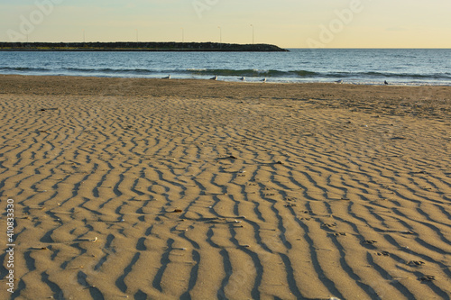 The shape formed on the beach due to the wind.