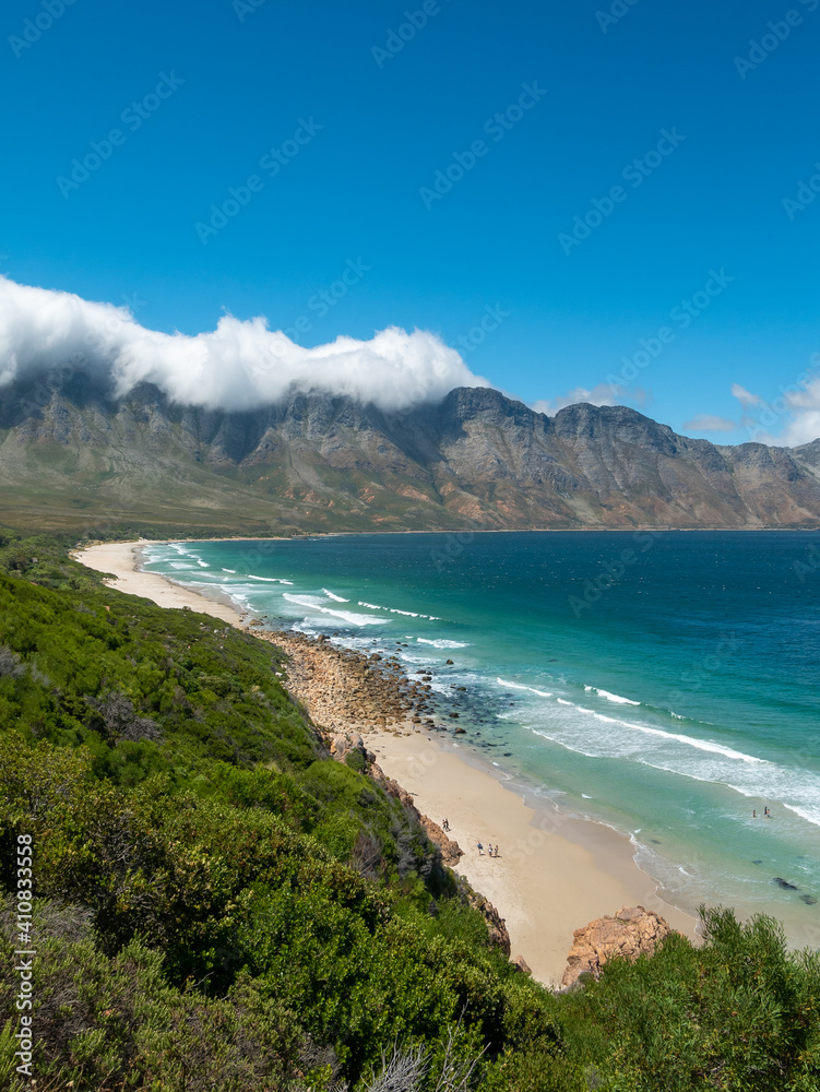 Incredible views of Kogel Bay Beach with the cloud covered Kogelberg Mountain Range forming a beautiful backdrop. Overberg. Western Cape. South Africa