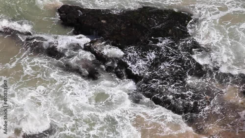 Waves crushing against rocks in Bali coast Waves crushing against rocks in Bali coast