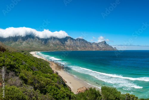 Incredible views of Kogel Bay Beach with the cloud covered Kogelberg Mountain Range forming a beautiful backdrop. Overberg. Western Cape. South Africa