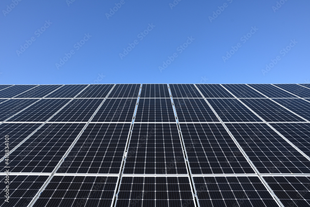 Solar panels against blue sky background.Against The Deep Blue Sky in suny weather Solar panels against blue sky background.Against The Deep Blue Sky in suny weather