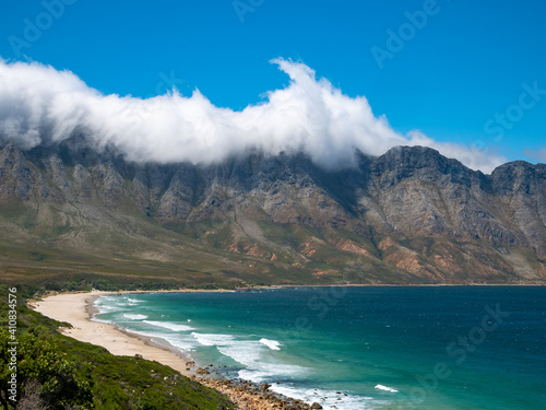 Incredible views of Kogel Bay Beach with the cloud covered Kogelberg Mountain Range forming a beautiful backdrop. Overberg. Western Cape. South Africa