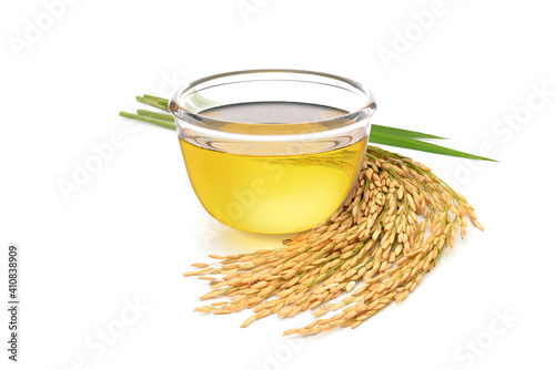 Rice bran oil with rice ears and leaves  isolated on white background.