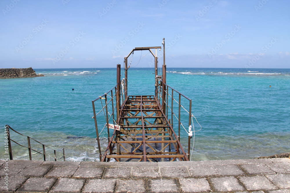 Abandoned historical pier in coast near Gala Salt Factory & Fishing Village in Yomitan Okinawa Japan. Abandoned historical pier in coast near Gala Salt Factory & Fishing Village in Yomitan Okinawa Japan.