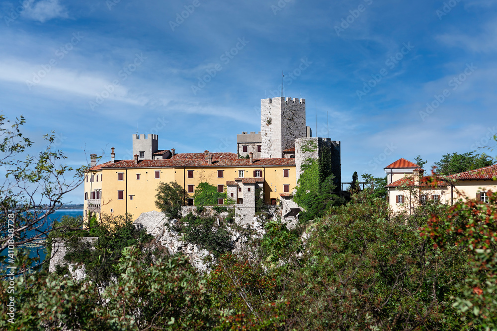 Gothic Duino castle on a cliff over the Gulf of Trieste (Adriatic sea), Italy.