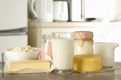 Different fresh dairy products on gray table
