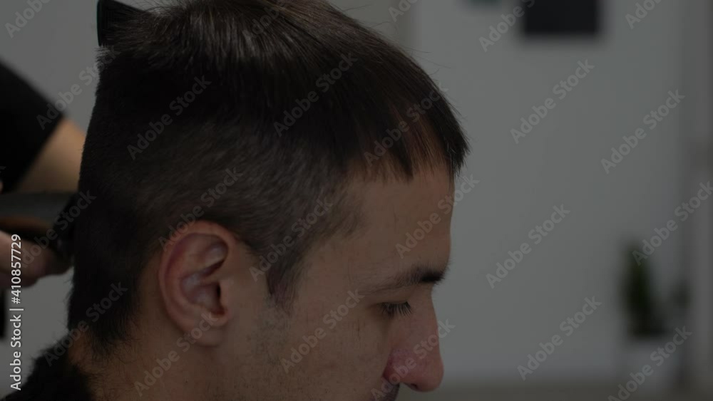Barber cutting hair with clipper Barber cutting hair with clipper