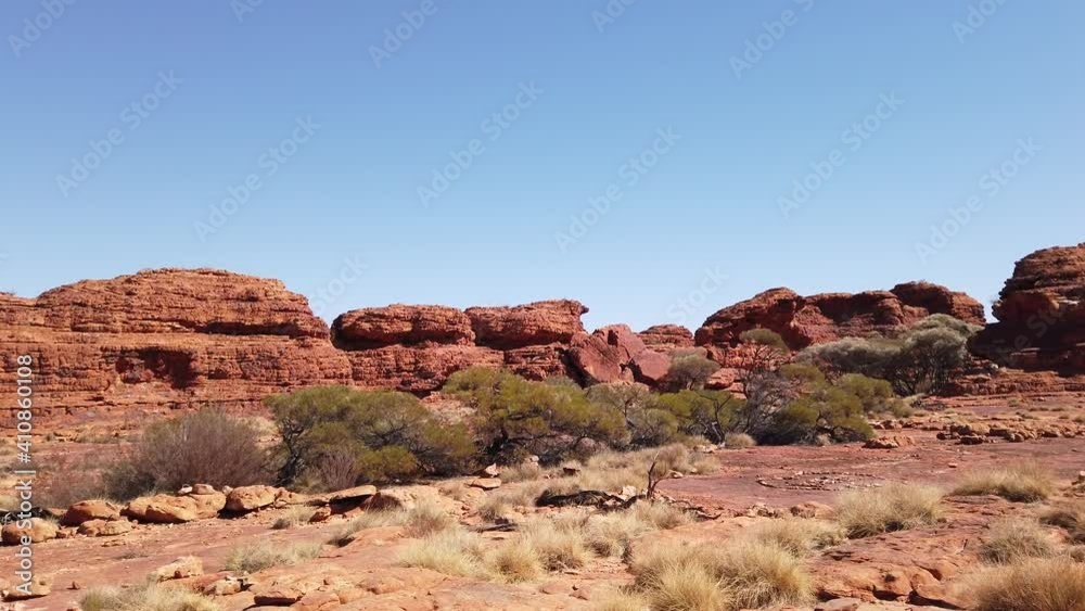 Scenic sandstone domes called The Lost City in Kings Canyon, Watarrka National Park, Central Australia. Iconic attraction place in Outback Red Center, Northern Territory. Sunset light. Scenic sandstone domes called The Lost City in Kings Canyon, Watarrka National Park, Central Australia. Iconic attraction place in Outback Red Center, Northern Territory. Sunset light.