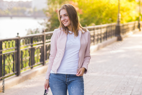 Portrait of a young happy and pretty blonde girl