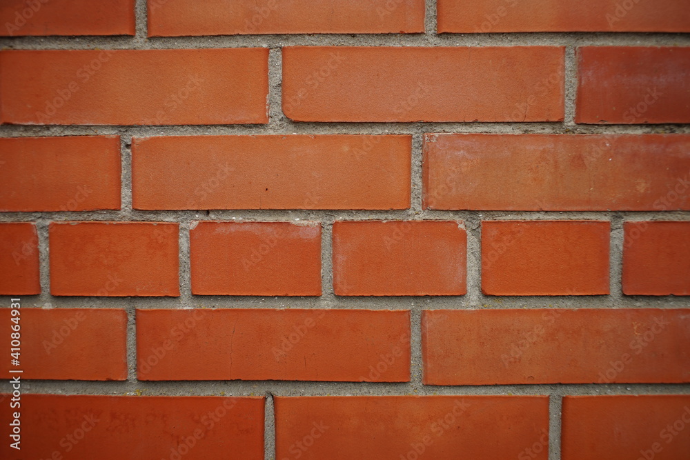 part of red brick wall with grey seams closeup part of red brick wall with grey seams closeup
