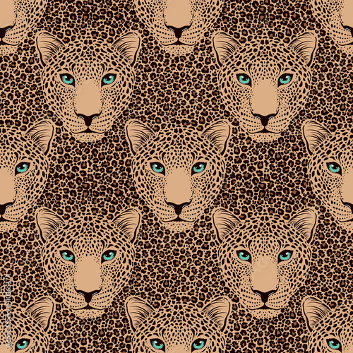 Seamless pattern with leopard muzzle and leopard fur.