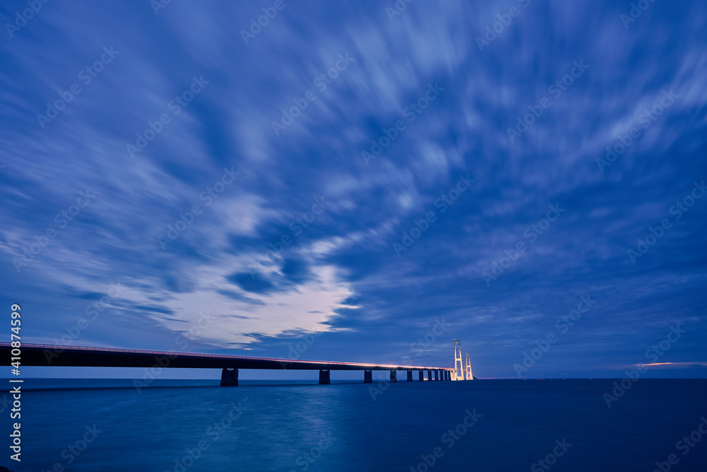 a bridge at night with beautiful blue sunset