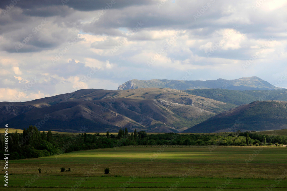 Beautiful summer landscape with a view of the valleys, green meadows and mountains in Crimea Beautiful summer landscape with a view of the valleys, green meadows and mountains in Crimea