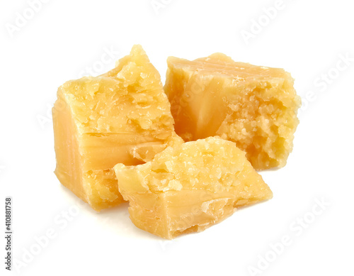 broken pieces of hard cheese isolated on white background