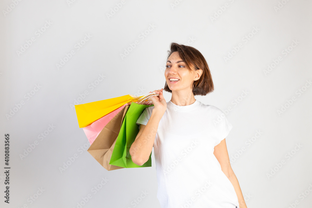 Studio photo of european woman with shopping bags on white background Studio photo of european woman with shopping bags on white background