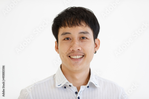 Portrait of young Asian businessman in casual clothing on white background