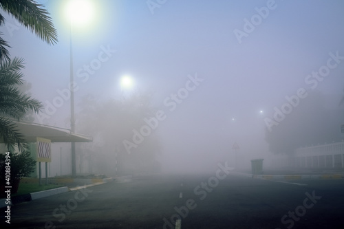 Road in the fog  sign mention keep distance for motorists at dubai road  foggy weather in UAE  Dense Fog keep Safe Distance banner in arabic and english