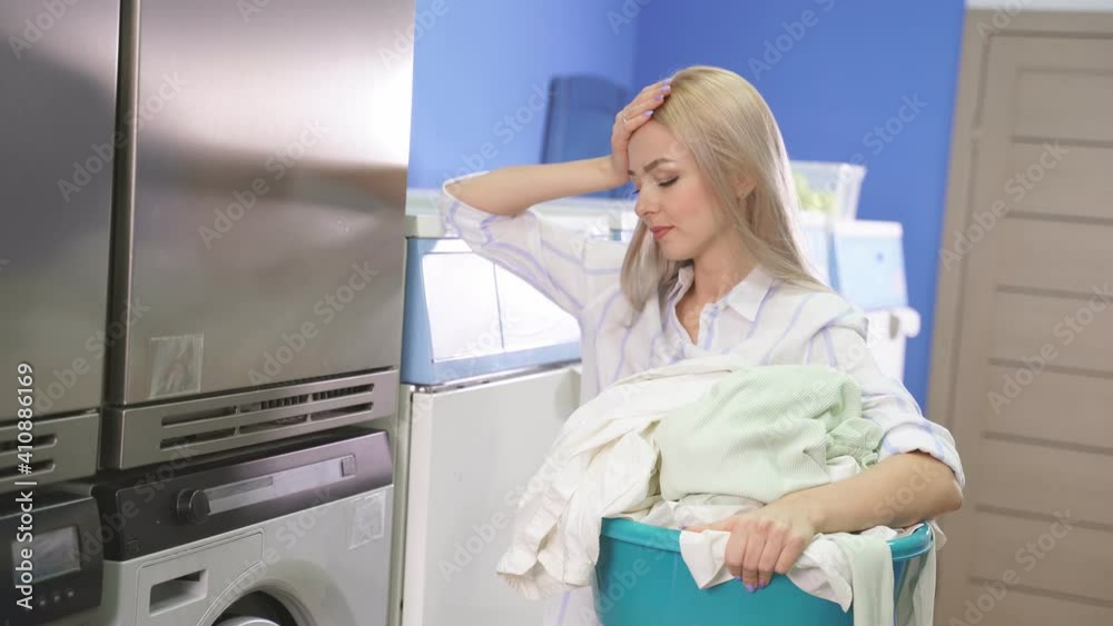 woman in a public laundry waiting for laundry, laundry room. woman in a public laundry waiting for laundry, laundry room.