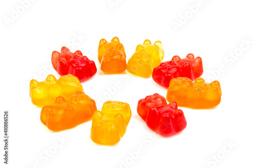 Children's vitamins in the form of bears are arranged in rows. A lot of multi-colored jelly sweets for children.