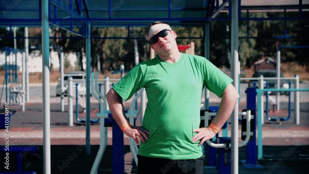 Funny male athlete doing warm-up exercise on the neck. Sports concept. Funny male athlete doing warm-up exercise on the neck. Sports concept.