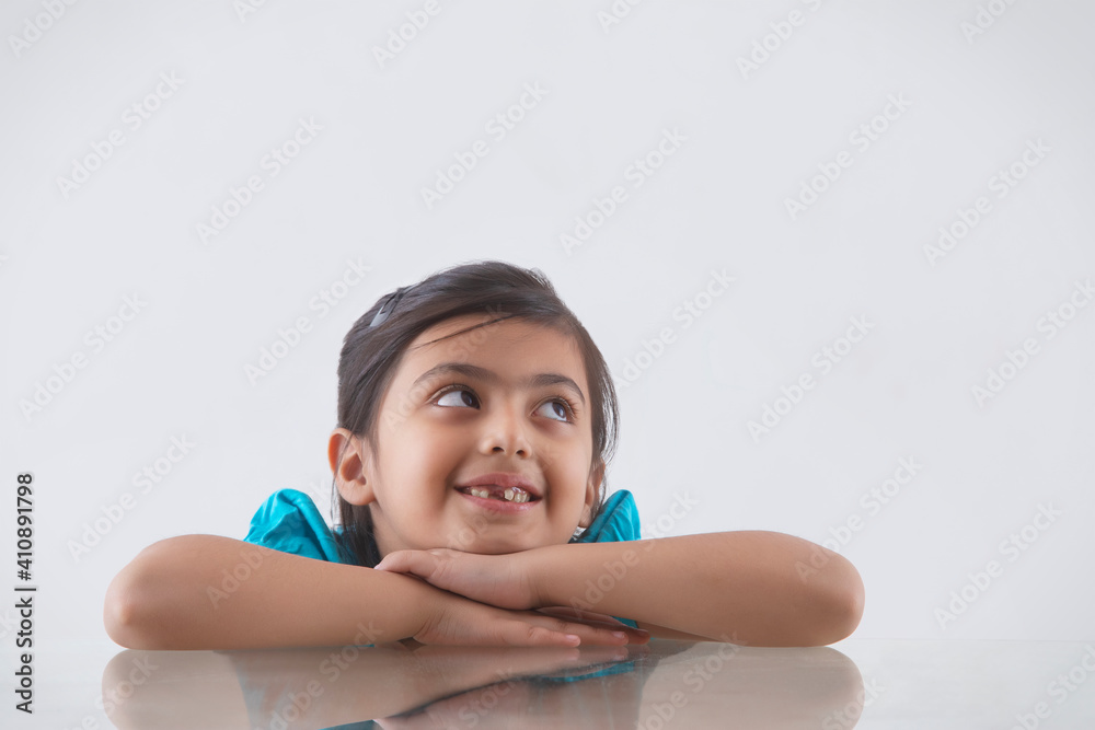portrait of a young girl looking sideways and smiling portrait of a young girl looking sideways and smiling
