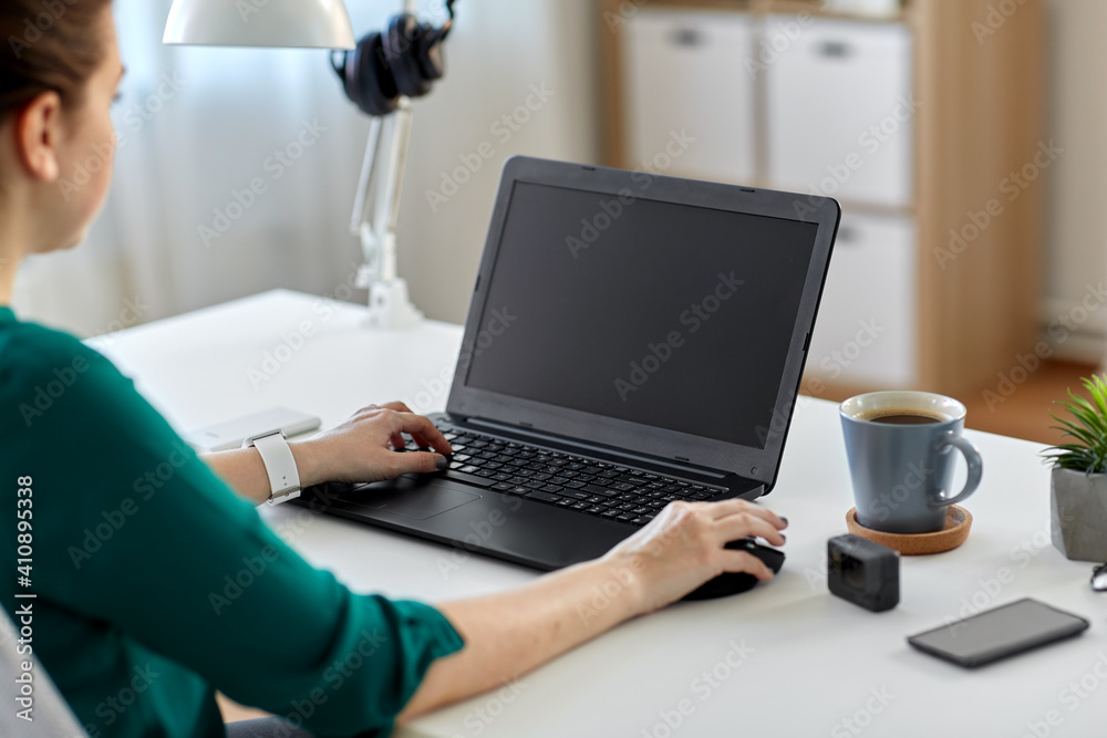 business, technology and people concept - woman with laptop computer working at home office business, technology and people concept - woman with laptop computer working at home office