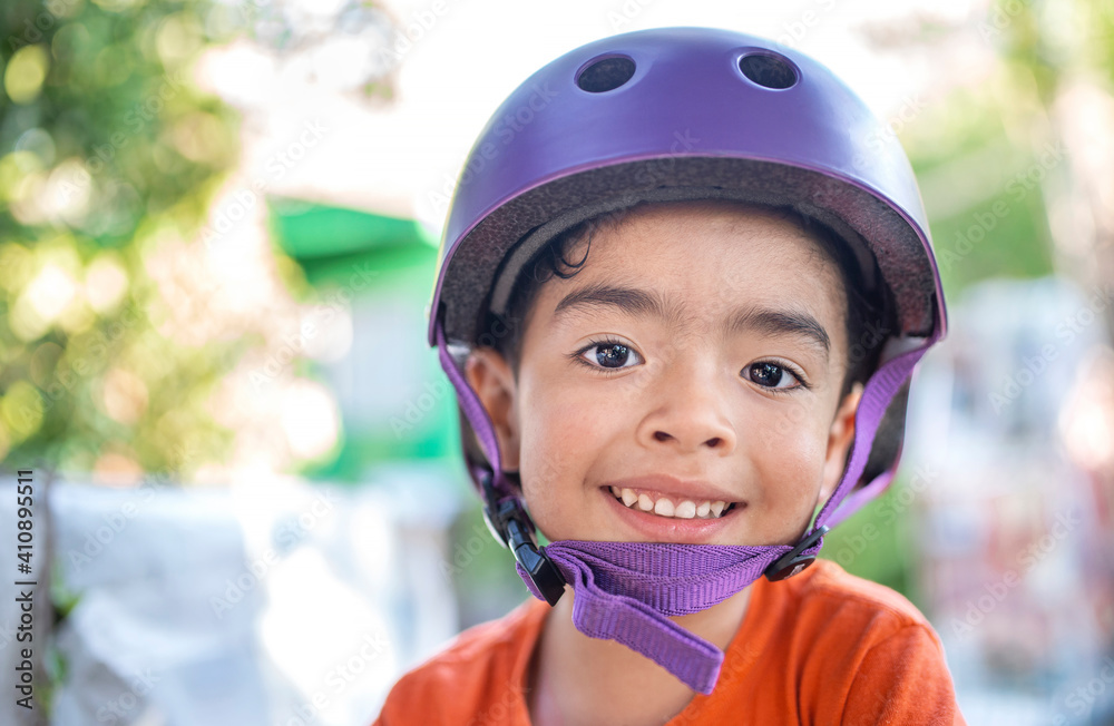 boy with violet helmet smiles and background with background boy with violet helmet smiles and background with background