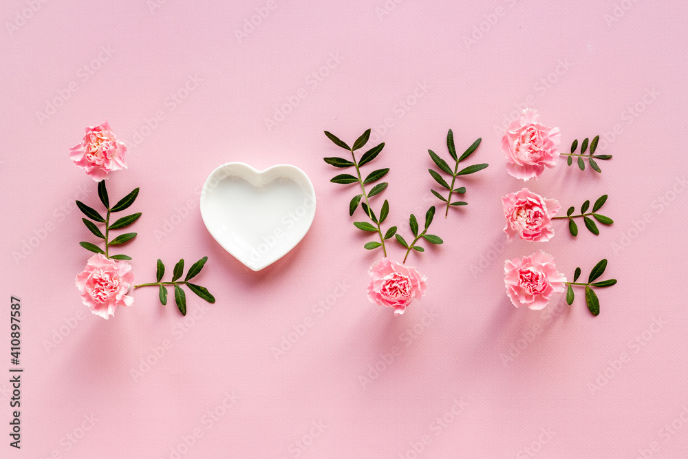 Word Love for greeting card of flowers and leaves. Top view - obrazy, fototapety, plakaty 
