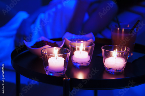 candles in spa with woman relaxing photo