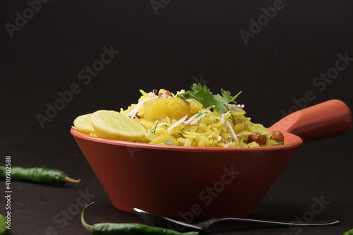 Indian Breakfast aalu Poha Also Know as kande Pohe made up of Beaten Rice or Flattened Rice. photo