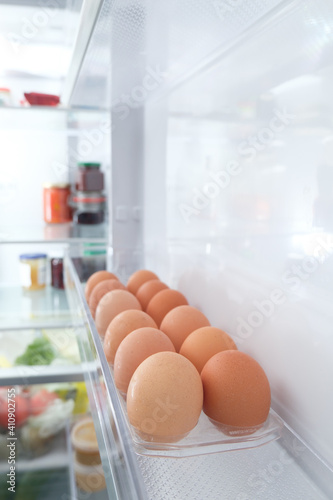 Healthy food clean eating selection: eggs on the shelf in the fridge