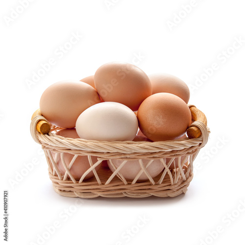 Organic eggs in the basket on the white background