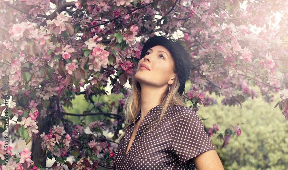 Portrait of a beautiful woman among spring foliage and flowers Portrait of a beautiful woman among spring foliage and flowers
