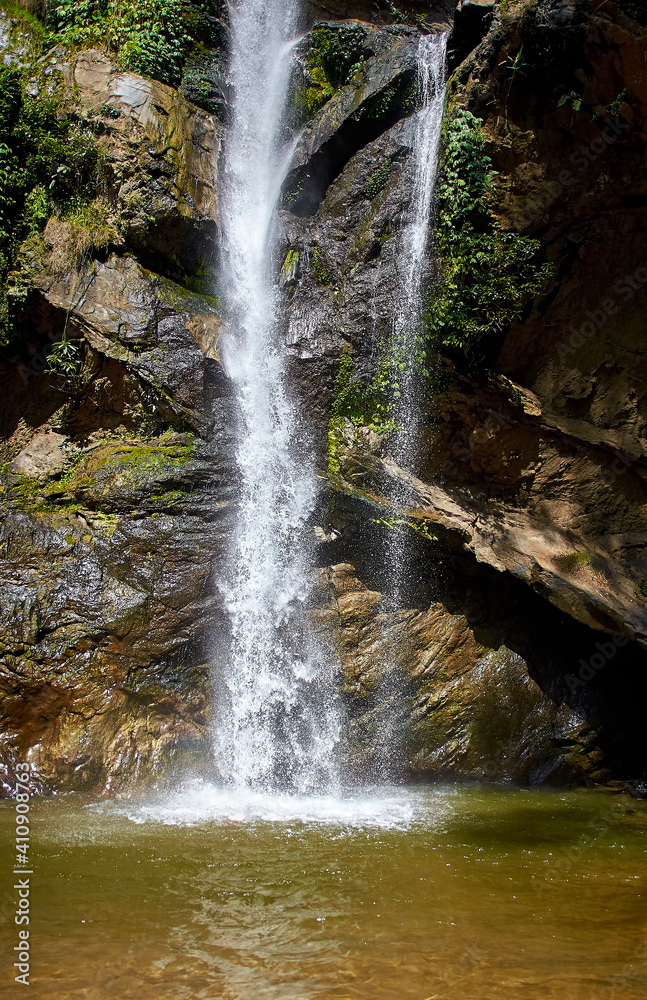 Obraz premium A waterfall in the jungle of northern Thailand. Chiang Mai province. Mork Fa Water Fall.