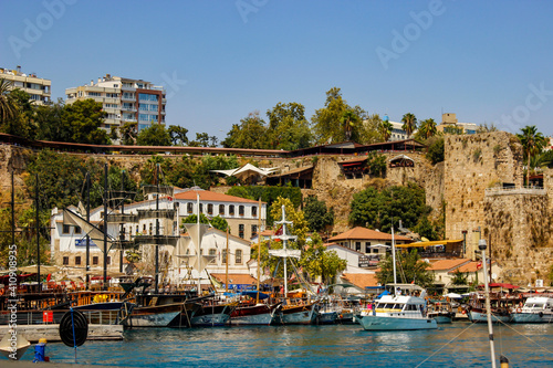 Antalya, Turkey - August 27, 2013: Anchored in the marina, historic yachts and tourist boats view of the blue sea in Kaleici, Antalya, Turkey. Selective focus. Holiday consept.