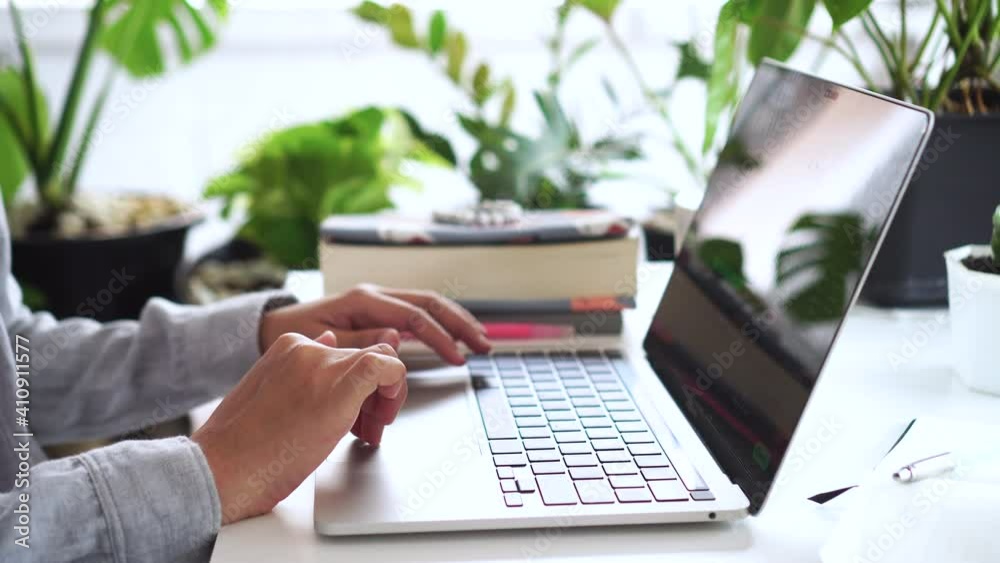 4k woman hand using laptop to work study with nature view Business, financial, trade stock maket and social network concept.