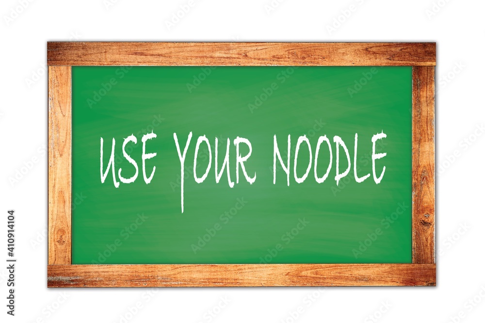 USE YOUR NOODLE text written on green school board. USE YOUR NOODLE text written on green school board.