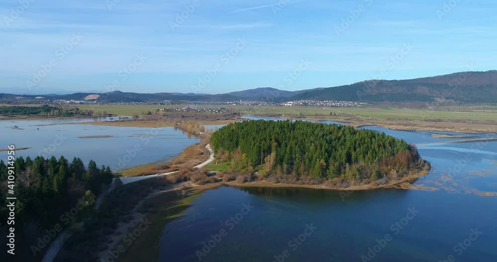 One of the largest intermittent lakes in Europe lake Cerknica. Aerial view of amazing landscape in Slovenia. Drone descending above karst pond One of the largest intermittent lakes in Europe lake Cerknica. Aerial view of amazing landscape in Slovenia. Drone descending above karst pond
