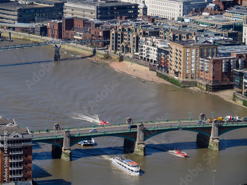 aerial view of the River Thames showing river boats going under Southwark bridge  photo