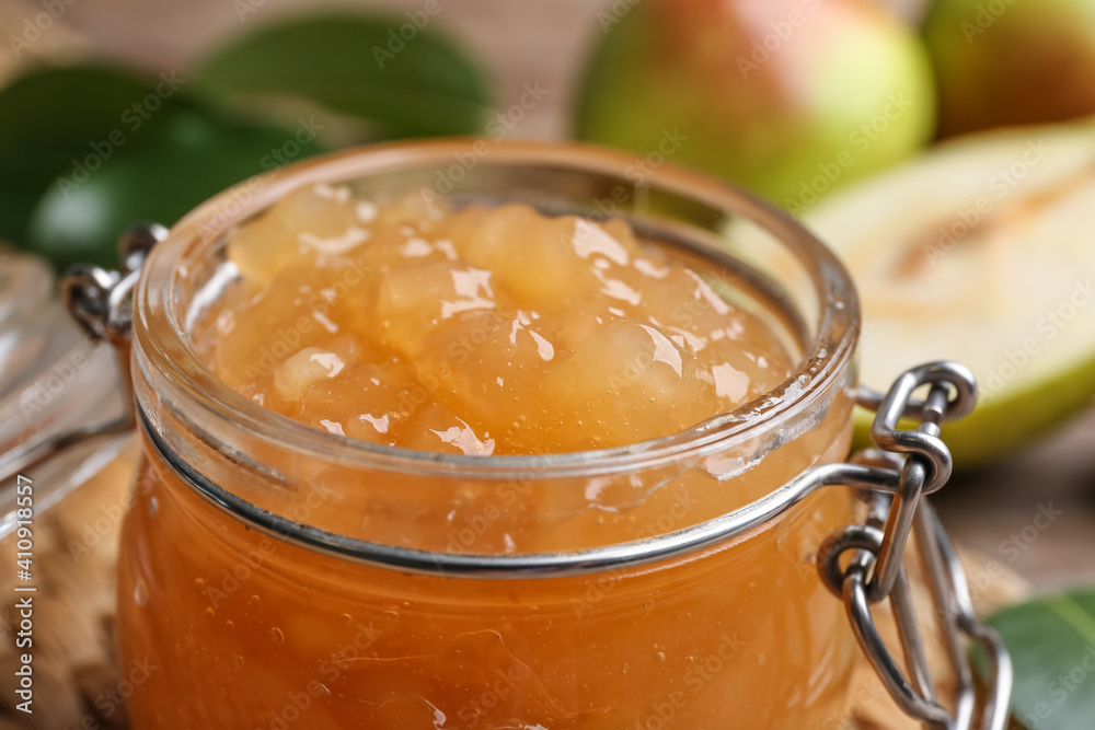 Delicious pear jam in glass jar, closeup Delicious pear jam in glass jar, closeup
