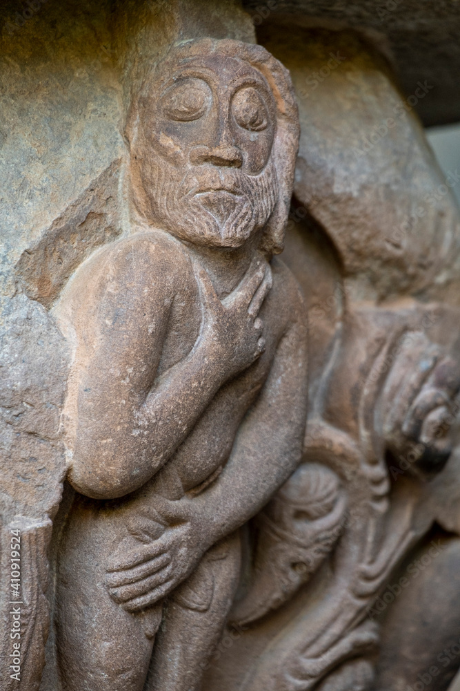 Naked Adam, romanic cloister, Royal Monastery of San Juan de la Peña, Botaya, Huesca, Aragon, Spain Naked Adam, romanic cloister, Royal Monastery of San Juan de la Peña, Botaya, Huesca, Aragon, Spain