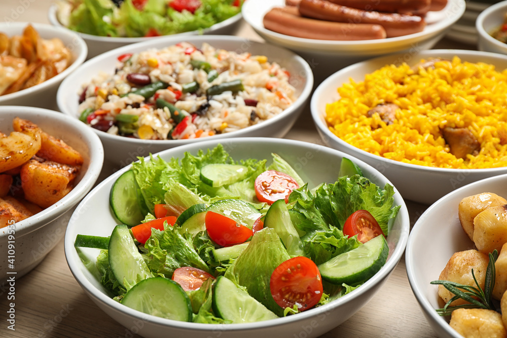 Different delicious dishes on table, closeup. Buffet service Different delicious dishes on table, closeup. Buffet service