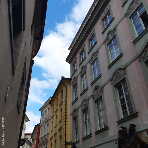 Street architecture in Prague, Czech Republic. The photo shows residential buildings typical of the Prague style. photo