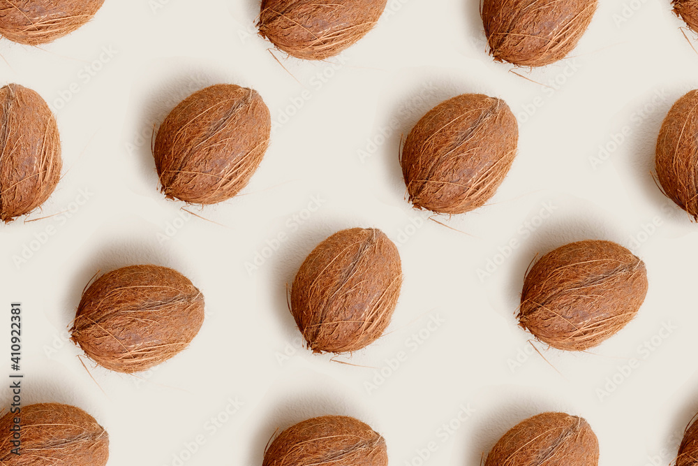 Seamless pattern of coconut on light natural color background. Wallpaper in organic lifestyle design. Wrapping paper for raw chocolate with coco. Cover for vegetarian recipes. Banner for kitchen Seamless pattern of coconut on light natural color background. Wallpaper in organic lifestyle design. Wrapping paper for raw chocolate with coco. Cover for vegetarian recipes. Banner for kitchen