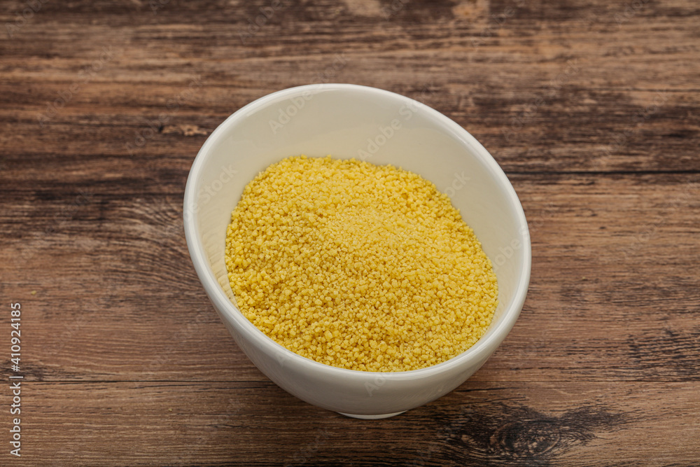 Raw cous cous heap in the bowl Raw cous cous heap in the bowl