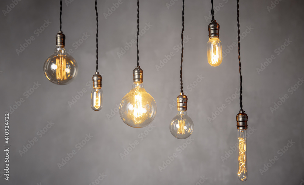 Set edison retro lamp on loft gray concrete background. Concept idea Set edison retro lamp on loft gray concrete background. Concept idea